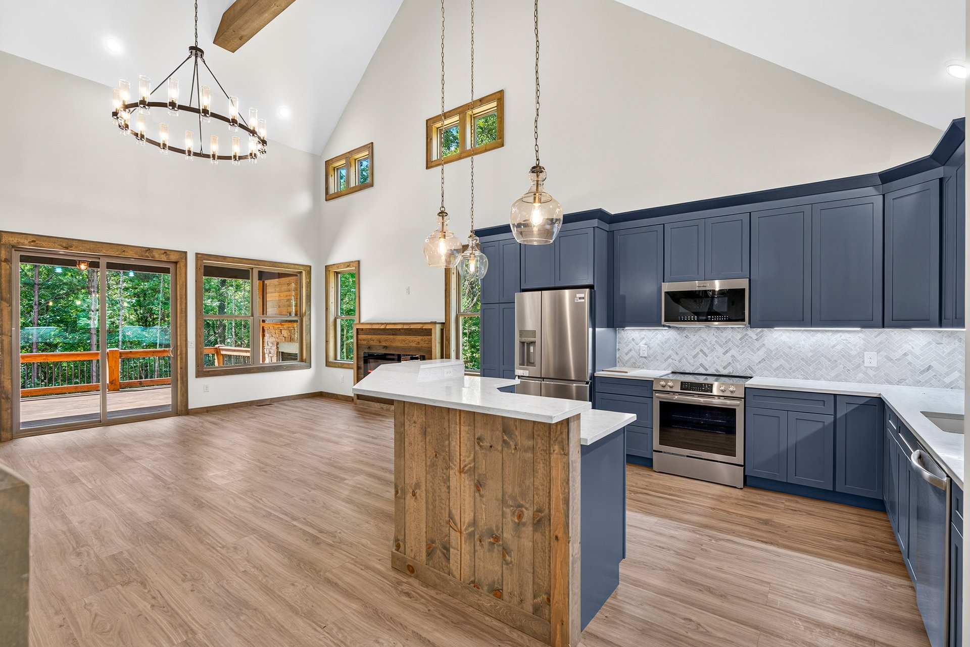 Kitchen island with pendant lights looking toward the living area at 824 Banks Rd, Ellijay, GA