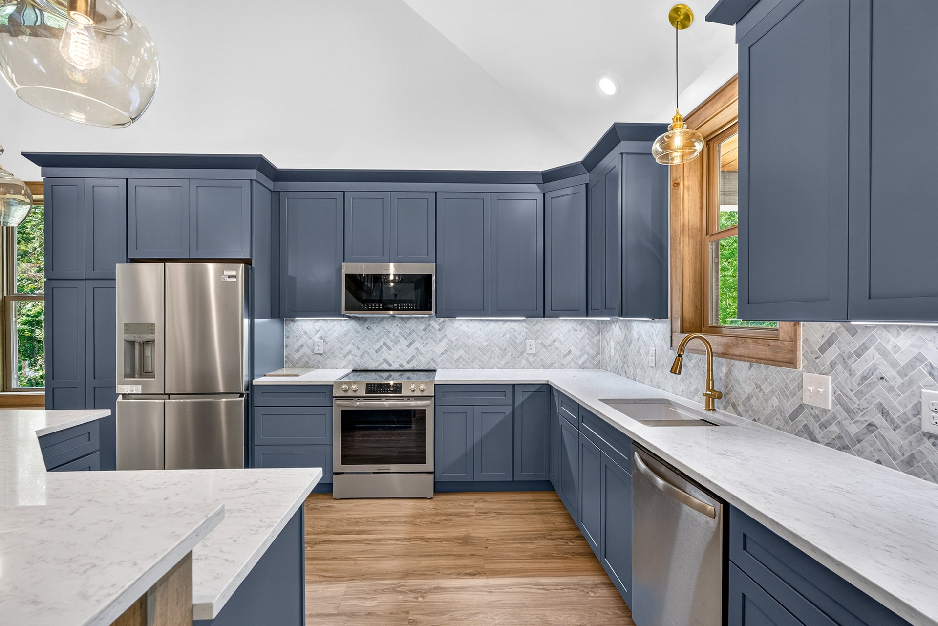 Kitchen from another angle showing dark cabinetry and stainless appliances at 824 Banks Rd, Ellijay, GA