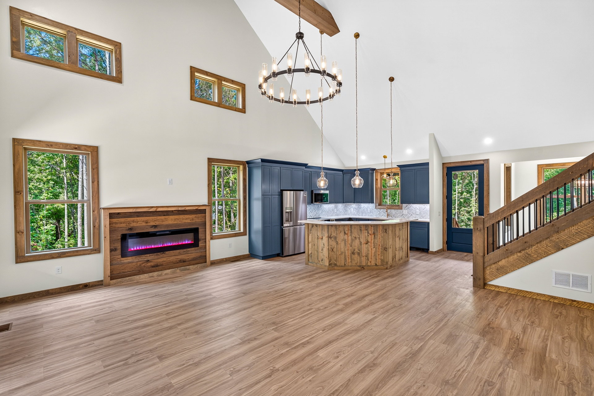 Open kitchen, fireplace, and staircase in one view at 824 Banks Rd, Ellijay, GA