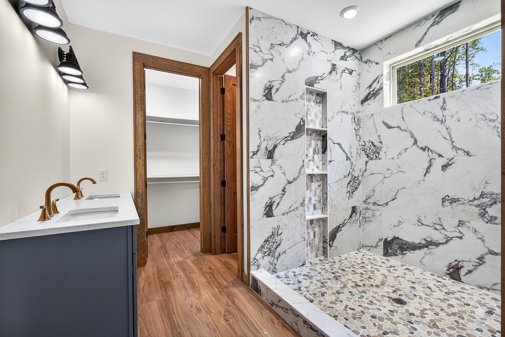Bath with blue vanity and marble-look walk-in shower at 824 Banks Rd, Ellijay, GA