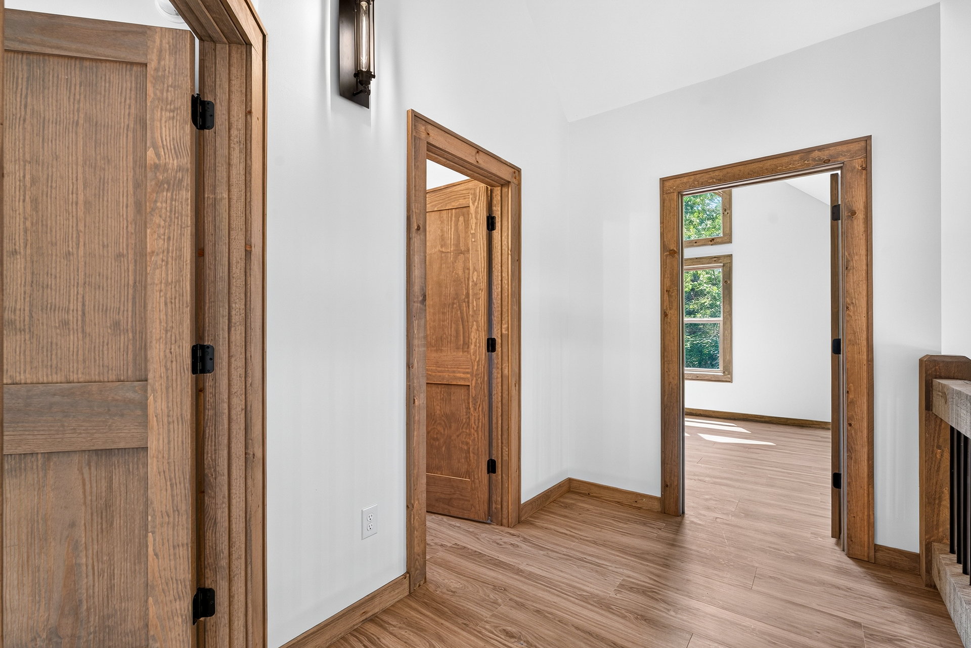 Hallway with natural wood doors and trim at 824 Banks Rd, Ellijay, GA