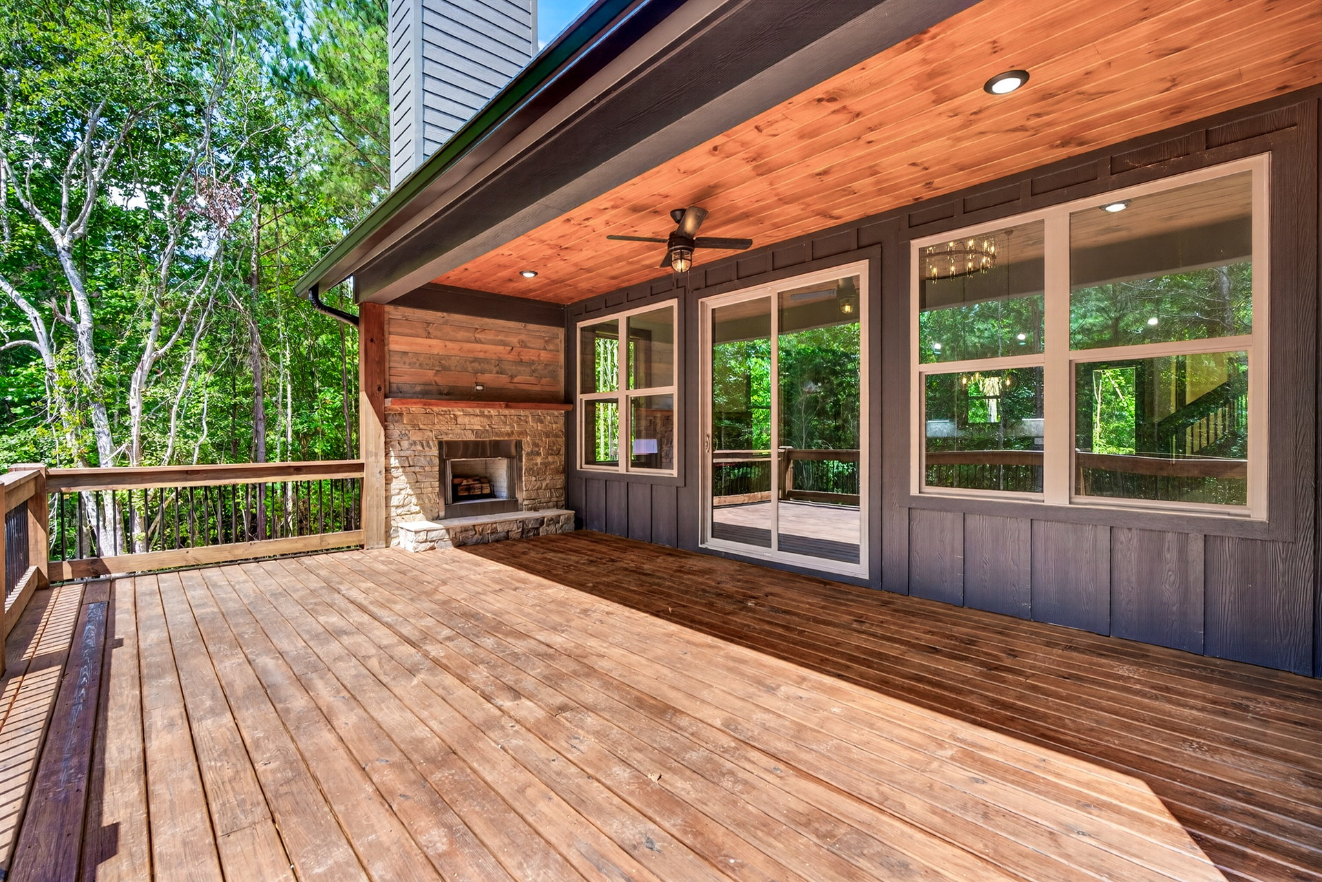 Wood deck with built-in stone outdoor fireplace at 824 Banks Rd, Ellijay, GA