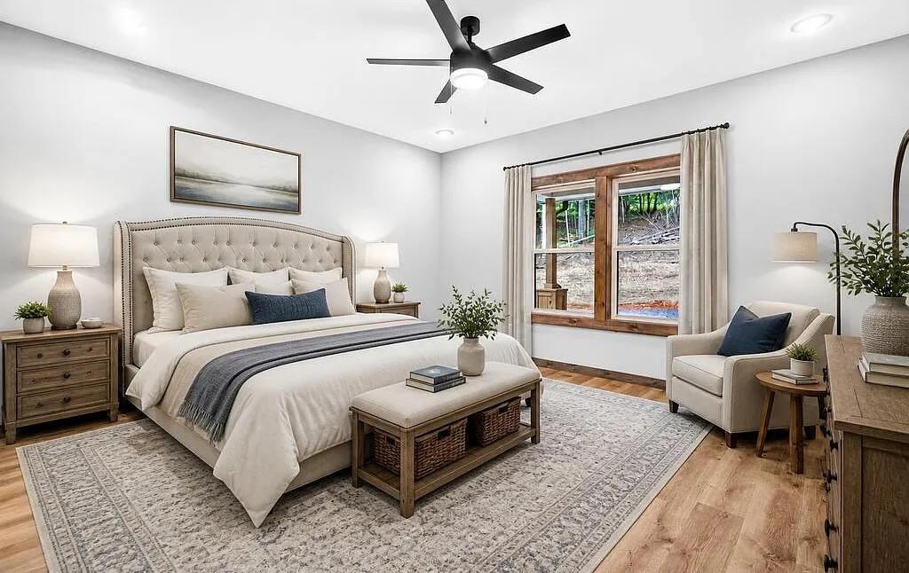 Bedroom with a tufted headboard, wood nightstands, and a large wood-framed window